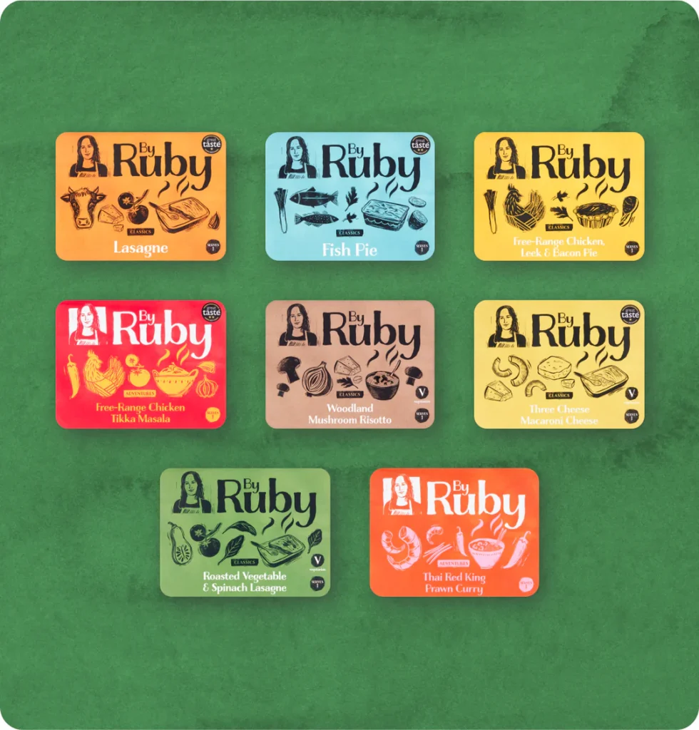 A selection of different flavours of By Ruby freezer meals with colourful backgrounds and drawings of the contents on the outside.